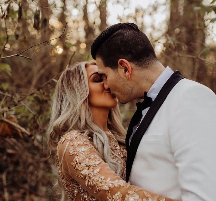 Alicia and Jason kissing in golden light