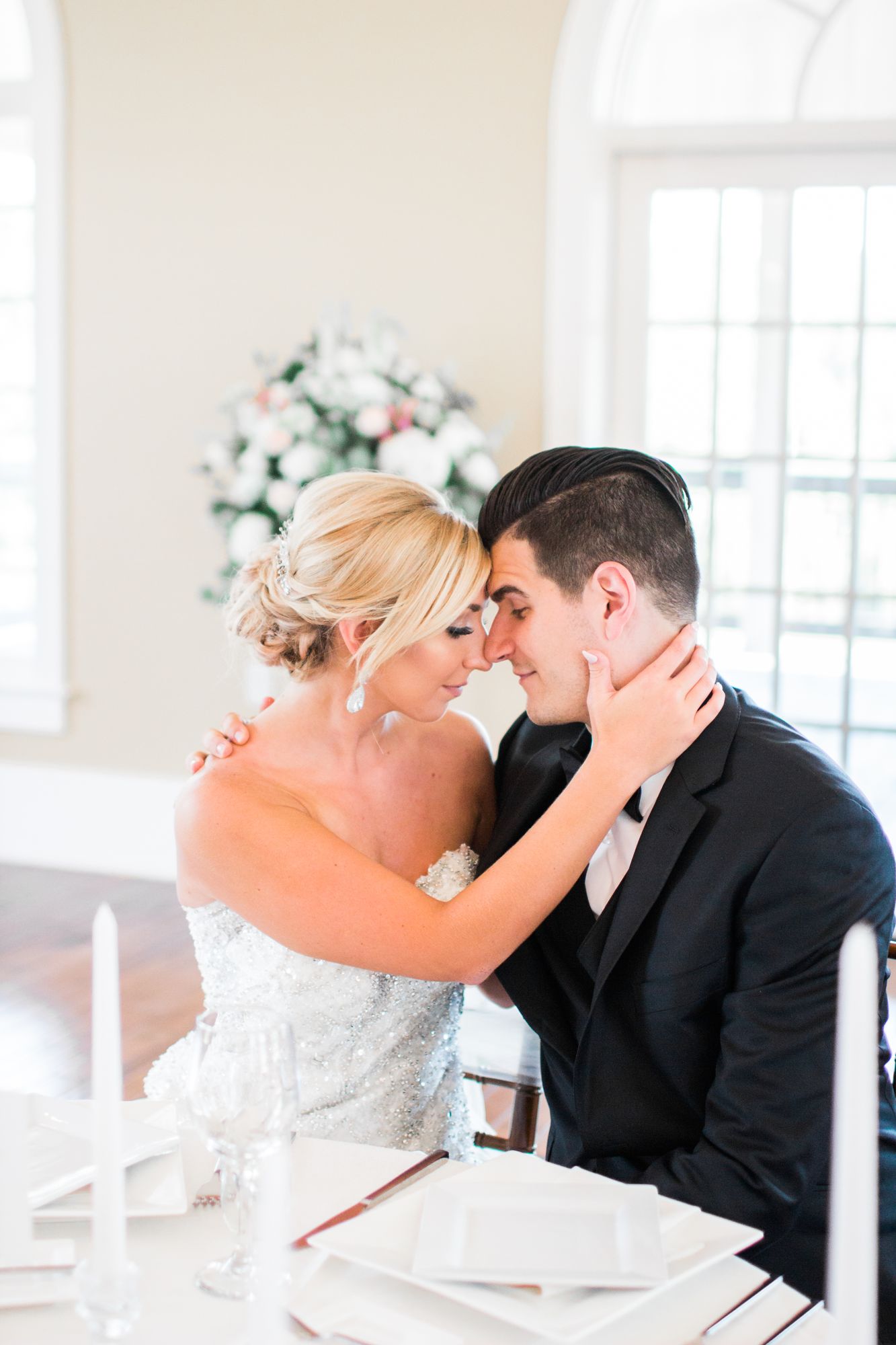 Alicia and Jason forehead to forehead on their wedding day